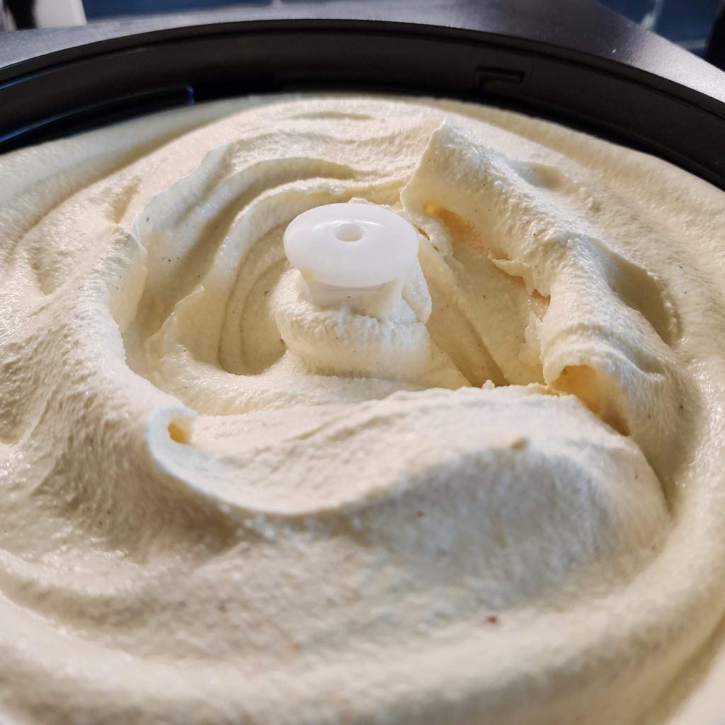 Freshly frozen eggnog ice cream has curls that look like crashing ocean waves.